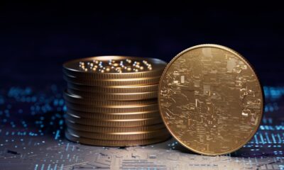 short stack of gold coins, with one standing on edge